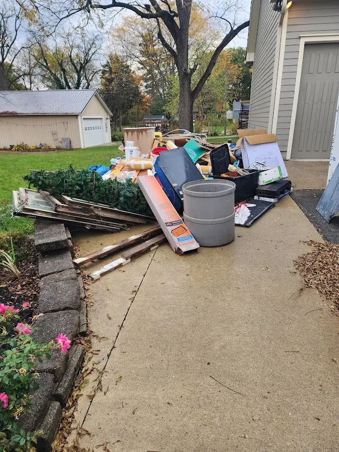 Dumpster being loaded with debris for 3 Yard Dumpster Rental in Hilltown
